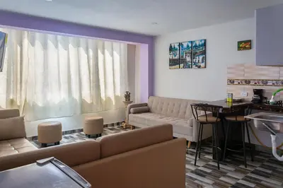 a living room with a couch and a table at TRANSFER VIP HOSTEL in Lima