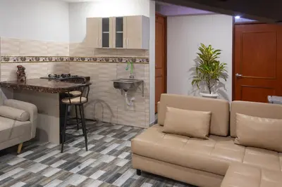 a living room with a couch and a sink at TRANSFER VIP HOSTEL in Lima