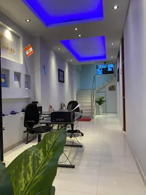 an office with desks and chairs and a blue ceiling at Millennium Hotel Corporative in San Vicente de Cañete