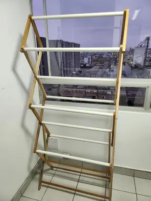 a shelf in a room with a window at Departamento amplio y acogedor San Miguel in Lima