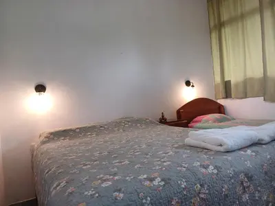 a bed in a bedroom with two towels on it at El Cacaotal Finca Faura #5 3H in San Ramón