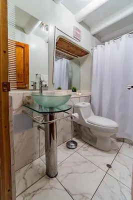 a bathroom with a sink and a toilet at Kori Gems Inn in Cusco