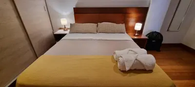 a bedroom with a bed with two towels on it at Departamento estreno 2do piso in La Molina