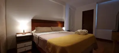 a bedroom with a bed with two towels on it at Departamento estreno 2do piso in La Molina