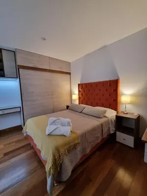 a bedroom with a bed with two towels on it at Departamento estreno 2do piso in La Molina