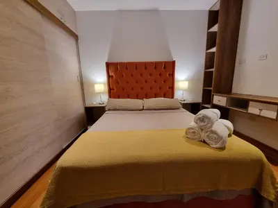 a bedroom with a bed with towels on it at Departamento estreno 2do piso in La Molina