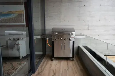 a kitchen with a stainless steel stove in a room at 3BR Paracas Kite Gym Work Oasis in Santo Domingo