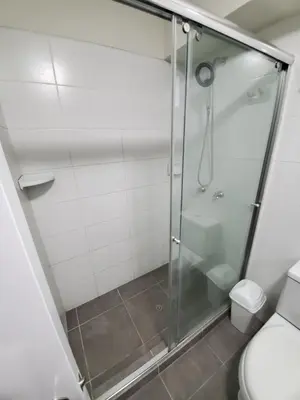 a shower stall in a bathroom with a toilet at New! Modern 4BR Apartment Miraflores Lima in Lima