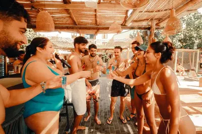 a group of people in bathing suits at a party at Viajero Huacachina Hostel in Ica