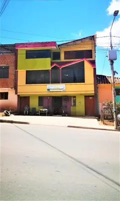 an empty street in front of a building at APARTAMENTO VISTA IMPERIAL II Mirador Panoramico in Cusco