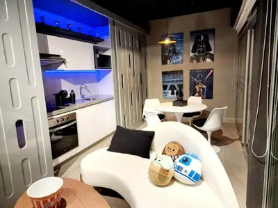 a living room with a white couch and a table at Audacity Moderno Departamento in Lima
