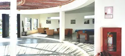 a living room with a couch and a table at Condominio Nautico Paracas in Pisco