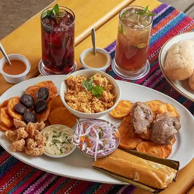 a white plate of food on a wooden table at Fundo Alma Andina in Jauja
