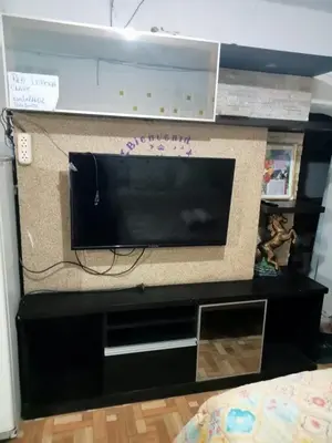 a entertainment center with a flat screen tv at POSADA CHABELITA in Lima