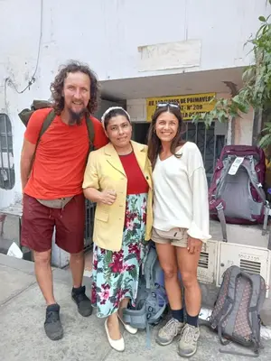 a group of three people posing for a picture at POSADA CHABELITA in Lima