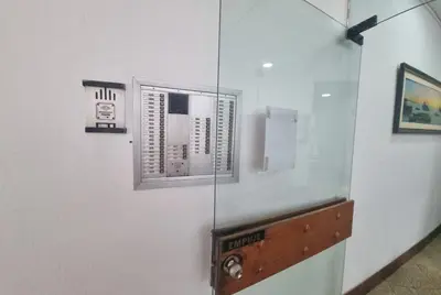 a glass wall with a window in a room at San Isidro Suites Basadre 1B403 in Lima