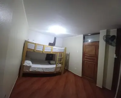 a small room with two bunk beds in it at HOME BLESSED II in Lima