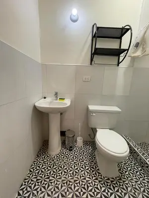 a bathroom with a toilet and a sink at Illa B&B in Cusco