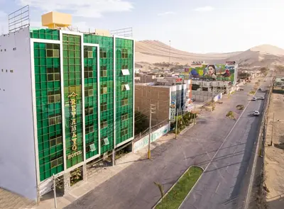 an overhead view of a city with a green building at Hotel Retamayo in Ica