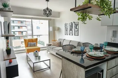 a living room with a couch and a table at Beautiful cozy Apt Barranco / Miraflores Peru in Lima