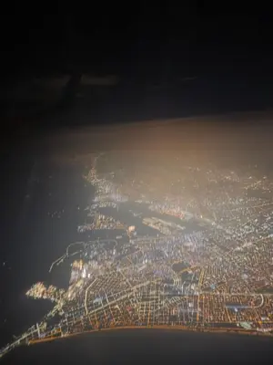an aerial view of a city at night at Sabina aeropuerto hostel in Lima