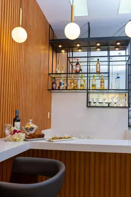 a bar in a restaurant with a counter and a chair at Hotel San Blas in Lima