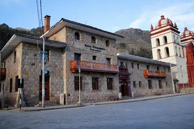 an old brick building on the side of a street at Hotel Presidente Huancavelica - Asociado Casa Andina in Huancavelica