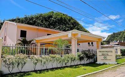a house with a fence in front of it at Hotel Presidente Selva in La Merced