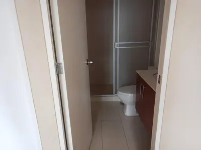a bathroom with a toilet and a glass shower at Apartment near to MIRAFLORES, BEACHES & REBAGLIATI HOSPITAL ! Panoramic View,Pool, Gym,Private Park in LINCE in Lima