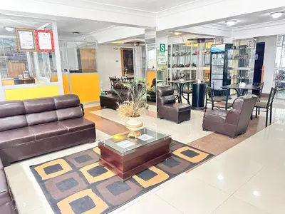 a living room with couches and chairs in a store at Libertrek Centro Inn in Cusco