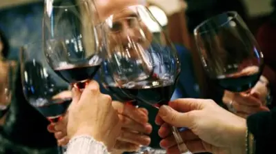 a group of people holding up wine glasses at Posada del Mirador Italyan Villa in San Bartolo