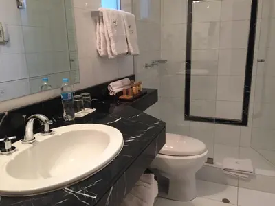 a bathroom with a sink and a toilet at Atiq Boutique Hotel in Cusco