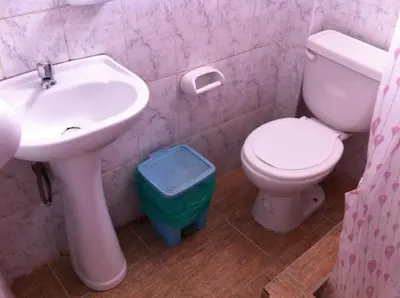 a bathroom with a sink and a toilet at El Balcon Hostal in Ayacucho