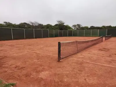 a tennis court with a net on top of it at Alquilo Casa playa in San Antonio
