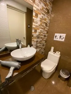 a bathroom with a sink and a toilet at Lince Apartments in Lima