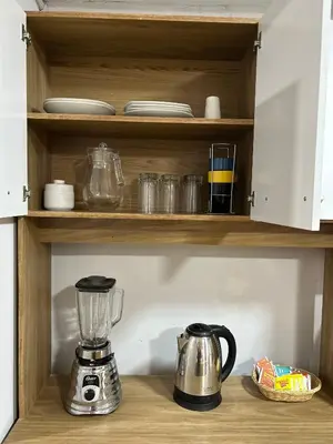 a kitchen counter with a blender on a shelf at Skyhousecusco in Cusco
