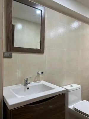 a bathroom with a sink and a toilet and a mirror at Skyhousecusco in Cusco