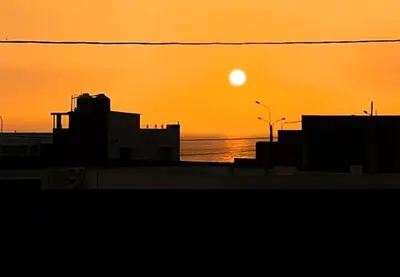 a sunset over the ocean with the sun in the sky at Alojamiento Punta Negra in Punta Negra