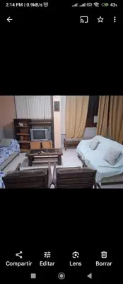 a picture of a room with two beds and a tv at Alojamiento Punta Negra in Punta Negra