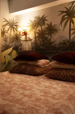 a bedroom with three leopard pillows on a bed at Chic Miraflores AC HEATER 16th floor in Lima
