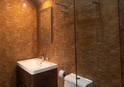 a bathroom with a sink and a shower at Hotel Precursores in Lima