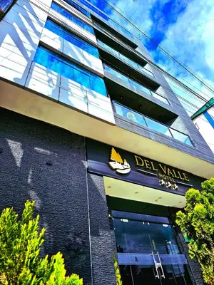 a building with a sign on the side of it at Hotel del Valle in Huancayo