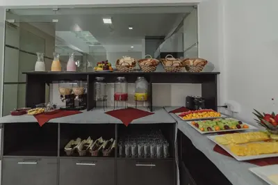 a kitchen with a buffet of food and drinks at Classic Hotel Cusco in Cusco