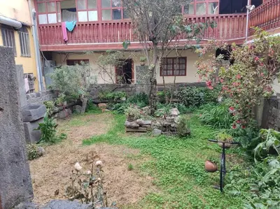 a garden in front of a house at Qosqo Apartments 3 in Cusco