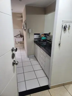 a small kitchen with a sink and a counter at rodrich business apartment in Lima