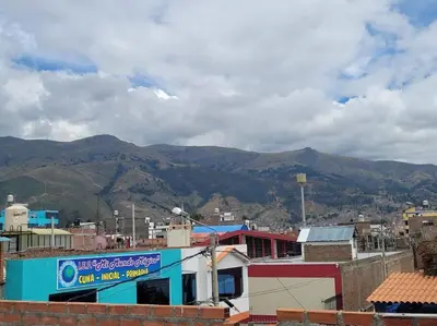 a view of a city with mountains in the background at Apartamento en Huancayo in Huancayo