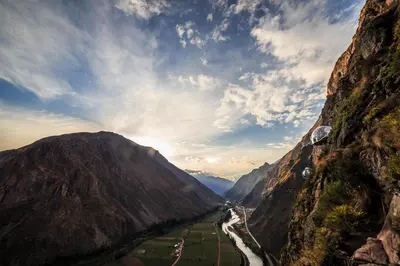 a view of a river between two mountains at Skylodge Adventure Suites in Urubamba