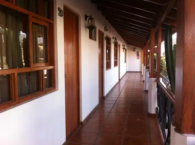 an empty corridor of a building with windows at Oro Viejo in Nazca