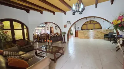 a large living room with couches and a table at Oro Viejo in Nazca