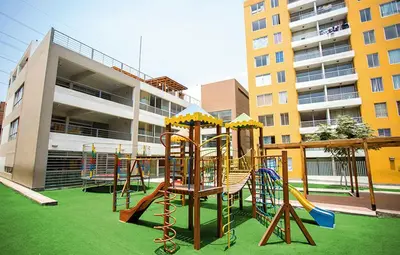 a playground in front of a building at Bonito departamento VIP estreno en Condominio in Lima